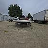 red 2001 International 4700/ Century Tilt Load