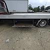 red 2001 International 4700/ Century Tilt Load