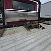 red 2001 International 4700/ Century Tilt Load