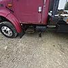 red 2001 International 4700/ Century Tilt Load