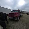 red 2001 International 4700/ Century Tilt Load