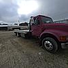 red 2001 International 4700/ Century Tilt Load